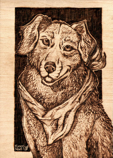 Art burned on wooden badge